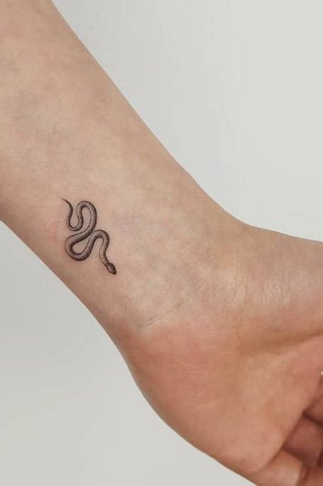 minimalist snake tattoo designs.